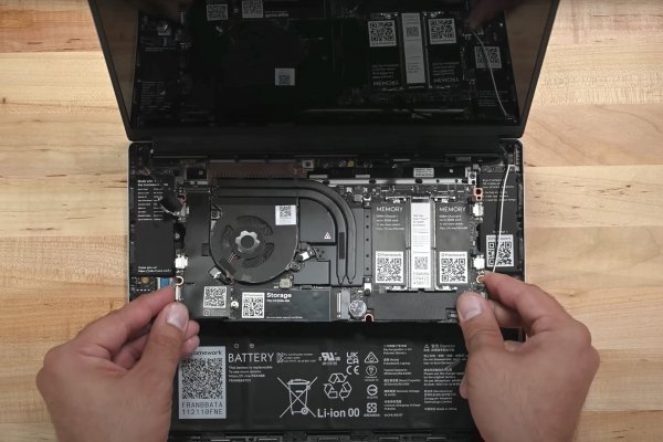 Replacing the motherboard in a Framework Laptop.