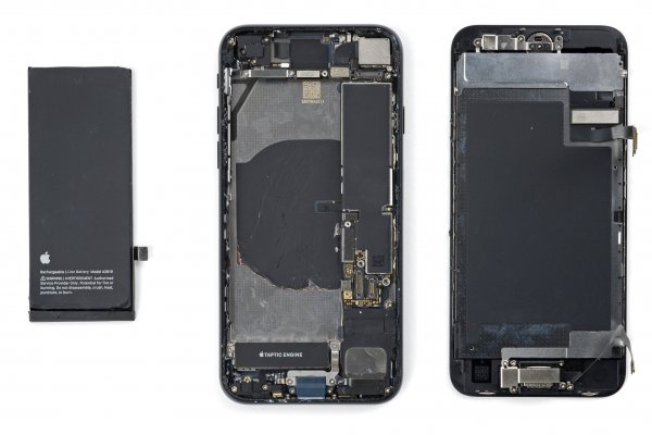 The interior of a 2022 iPhone SE with the battery and screen removed.