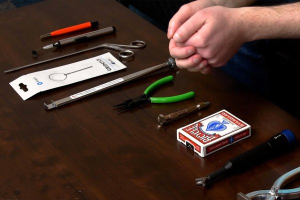Playing cards and other odd tools laid out on desk